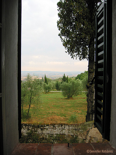 view out the window of the rolling Tuscan hills